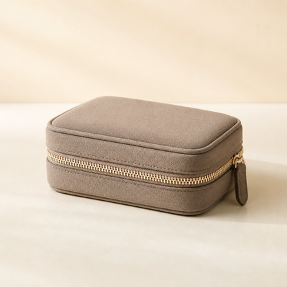 Taupe Averlomia Jewelry Travel Case with champagne zipper on an ivory background