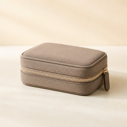 Taupe Averlomia Jewelry Travel Case with champagne zipper on an ivory background