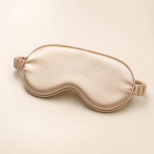Champagne beige Averlomia Satin Sleep Mask on an ivory studio background