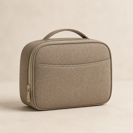 Taupe Averlomia Weekender Toiletry Case with champagne zipper on an ivory studio background